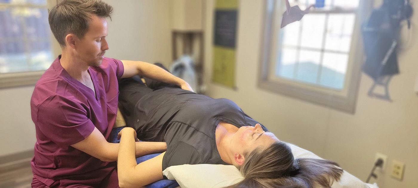 Dr. Starsiak performing osteopathic manipulation